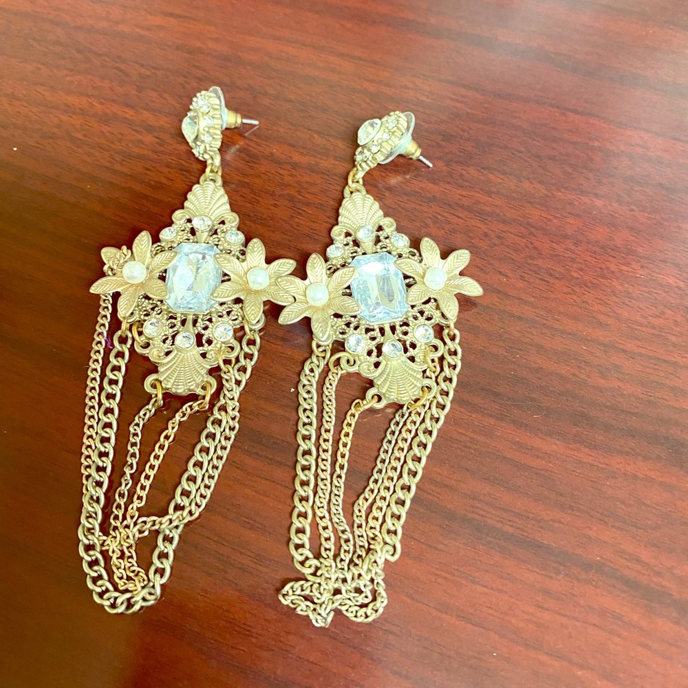 Gold earrings.